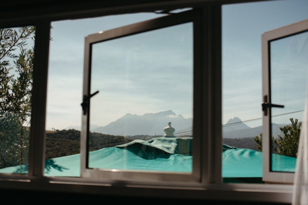 Minimalist eco bathroom design with greenery supporting eco-living and nature immersion in Hoekwil at Mountain Magic