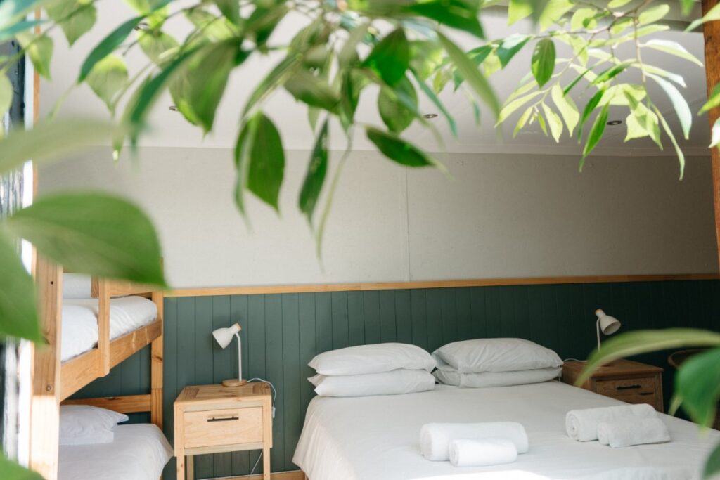 Eco-living and nature immersion in Hoekwil at Mountain Magic featuring a tranquil bedroom with natural light and scenic views
